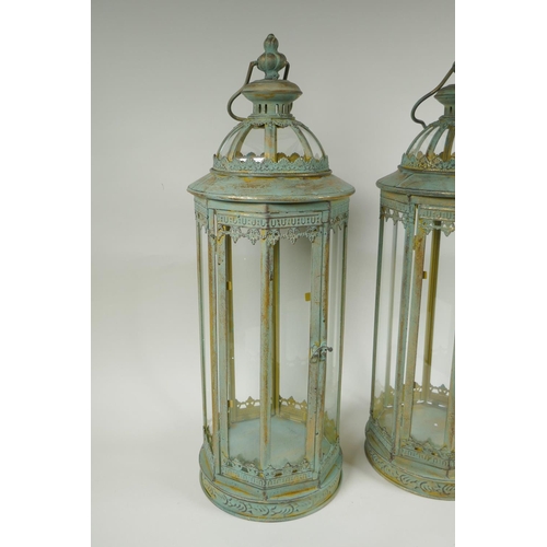 223 - A pair of gilt and verdigris metal lanterns, 59cm high