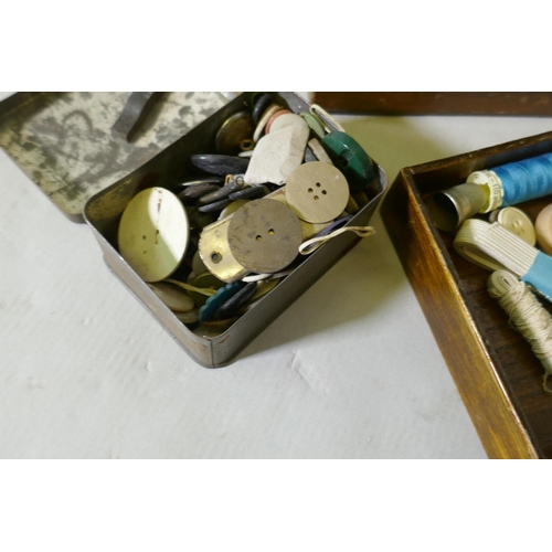 224 - An oak workbox containing vintage buttons and threads, 38 x 28 x 23cm