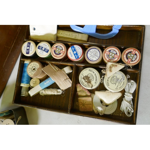 224 - An oak workbox containing vintage buttons and threads, 38 x 28 x 23cm