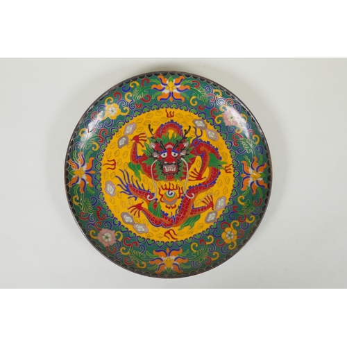 228 - A Chinese cloisonne dish decorated with a dragon and flaming pearl, 25cm diameter