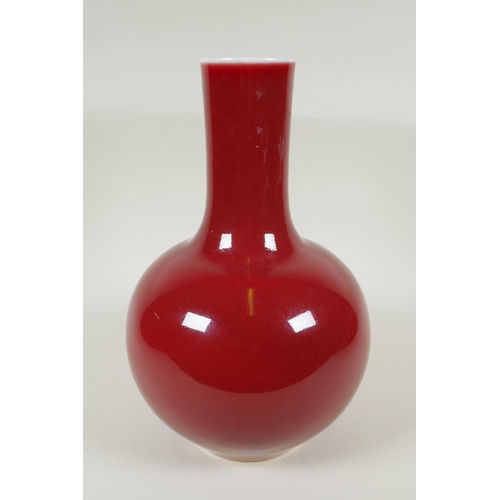 235 - A Chinese flambe glazed porcelain bottle vase, KangXi 6 character mark to base, 33cm high