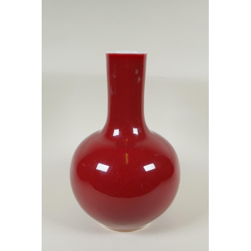 235 - A Chinese flambe glazed porcelain bottle vase, KangXi 6 character mark to base, 33cm high