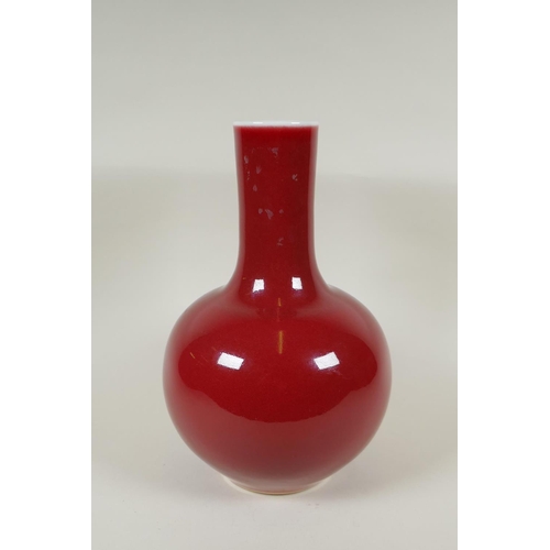 235 - A Chinese flambe glazed porcelain bottle vase, KangXi 6 character mark to base, 33cm high