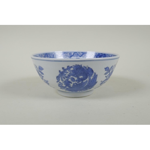 240 - A Chinese blue and white porcelain bowl with phoenix and floral decoration, Qianlong 6 character mar... 