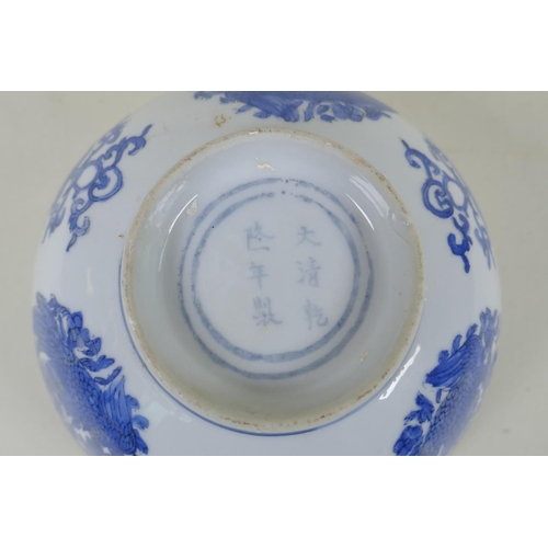 240 - A Chinese blue and white porcelain bowl with phoenix and floral decoration, Qianlong 6 character mar... 