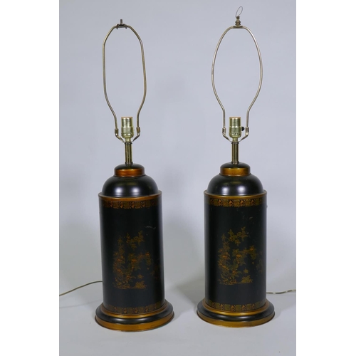 243 - A pair of toleware table lamps with parcel gilt decoration on a black ground, 82cm high