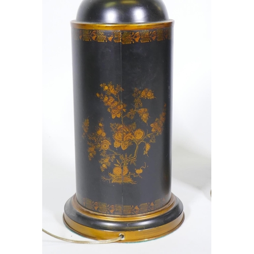 243 - A pair of toleware table lamps with parcel gilt decoration on a black ground, 82cm high