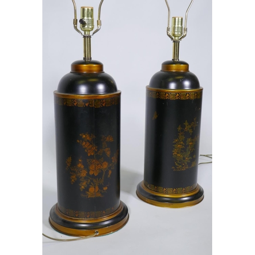 243 - A pair of toleware table lamps with parcel gilt decoration on a black ground, 82cm high