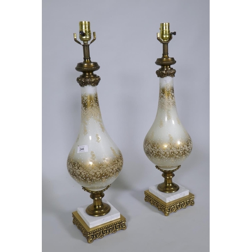 246 - A pair of silver plated glass table lamps with brass mounts and marble base, 70cm high