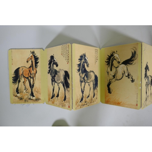 247 - A Chinese concertina book, the cardboard leaves with print of ponies and inscriptions, 28 x 18 x 11c... 