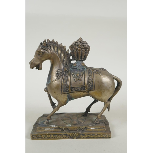 249 - A Tibetan filled metal figure of a horse, 17cm high