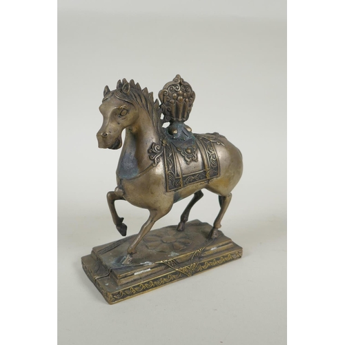 249 - A Tibetan filled metal figure of a horse, 17cm high