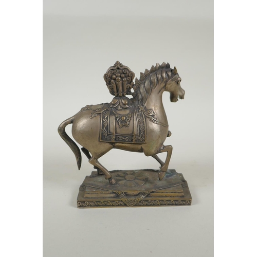 249 - A Tibetan filled metal figure of a horse, 17cm high