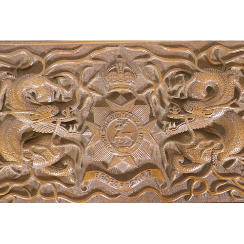 25 - A Kashmiri/Burmese carved box inscribed with the regimental badge of the Bedfordshire Regiment, and ... 