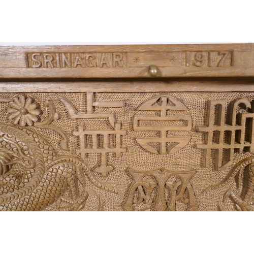 25 - A Kashmiri/Burmese carved box inscribed with the regimental badge of the Bedfordshire Regiment, and ... 