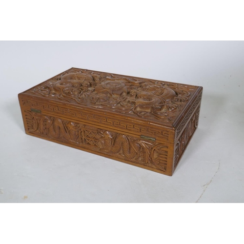 25 - A Kashmiri/Burmese carved box inscribed with the regimental badge of the Bedfordshire Regiment, and ... 