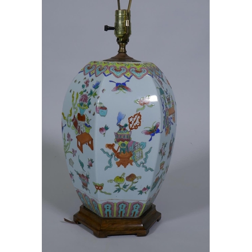 250 - A Chinese porcelain table lamp with famille verte enamel decoration, on a wood base, 64cm high