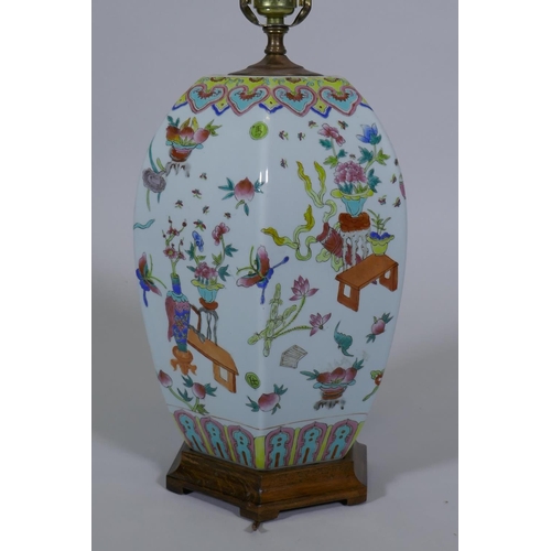 250 - A Chinese porcelain table lamp with famille verte enamel decoration, on a wood base, 64cm high