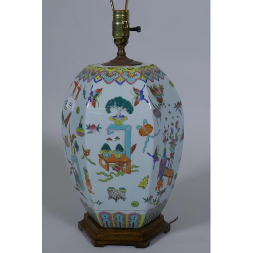 250 - A Chinese porcelain table lamp with famille verte enamel decoration, on a wood base, 64cm high