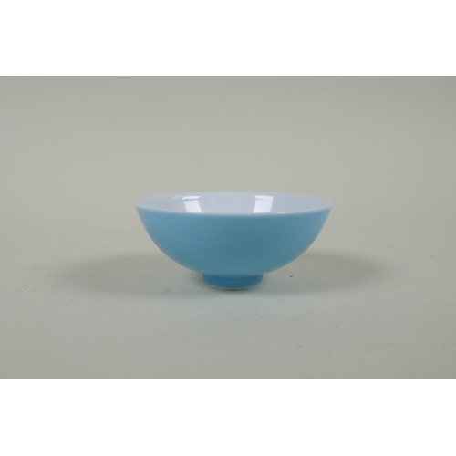 253 - A Chinese powder blue glazed porcelain tea bowl, GuangXu 6 character mark to base, 8cm diameter