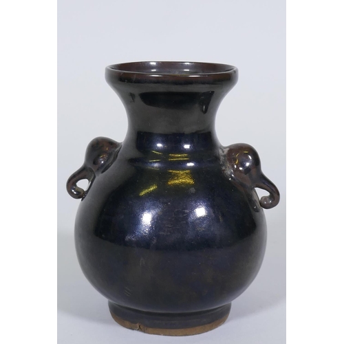 259 - A Chinese ceramic vase with elephant mask handles and famille noire glaze over a crackle body, 15cm ... 