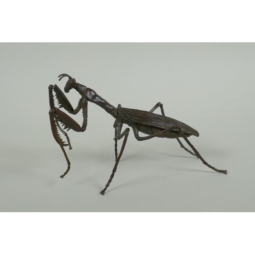 260 - A Japanese style bronze okimono of a mantis, with articulated limbs, 15cm long