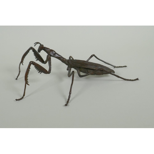 260 - A Japanese style bronze okimono of a mantis, with articulated limbs, 15cm long