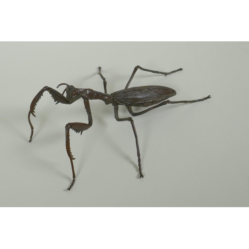 260 - A Japanese style bronze okimono of a mantis, with articulated limbs, 15cm long