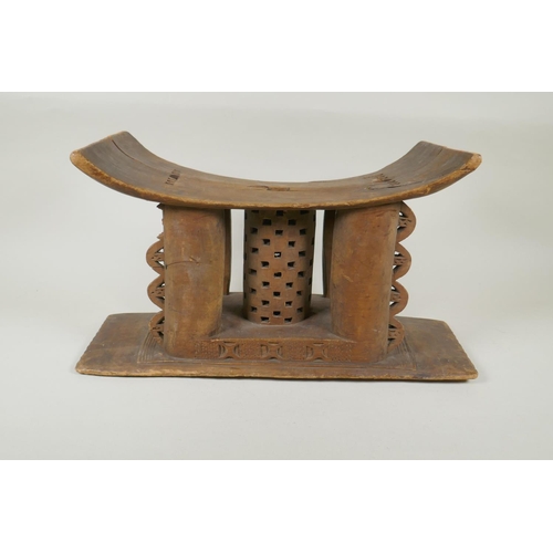 261 - An African Ashanti tribe carved wood stool and another smaller, both first half of the C20th, AF rep... 