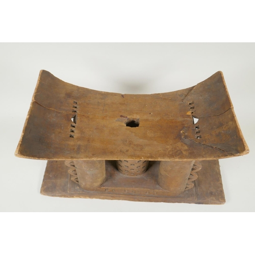 261 - An African Ashanti tribe carved wood stool and another smaller, both first half of the C20th, AF rep... 