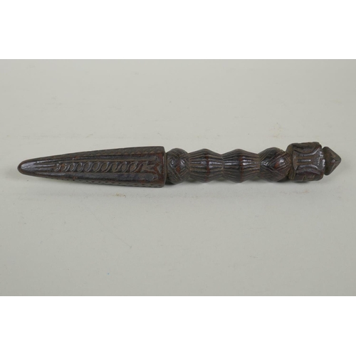 264 - An antique Tibetan ceremonial carved hardwood phurba, 23cm