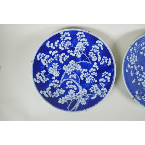 270 - A C19th Chinese blue and white porcelain charger decorated with prunus blossom on a cracked ice grou... 