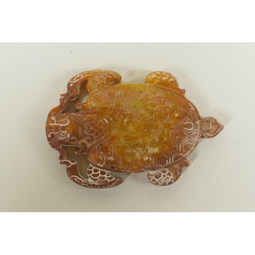 275 - A Chinese carved and pierced hardstone pendant in the form of a dragon turtle, 9cm long