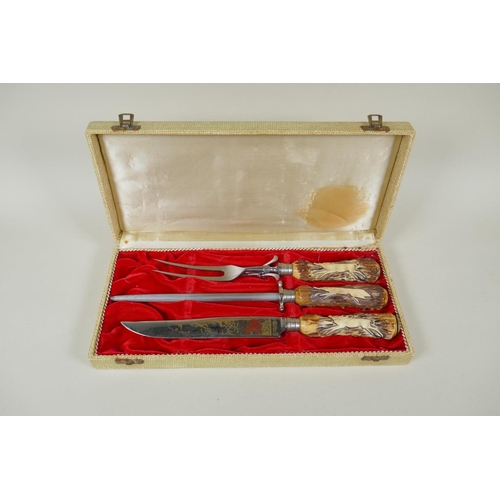 276 - A cased carving set by Anton Wingen Jr of Solingen, Germany, with carved antler handles decorated wi... 