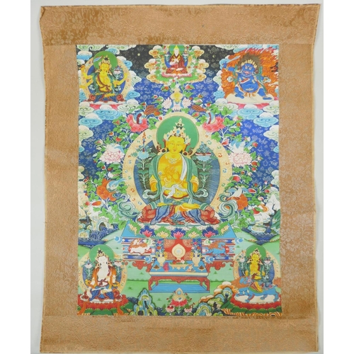 278 - A Tibetan printed Thangka depicting Manjushri, with a silk surround, 39 x 49cm