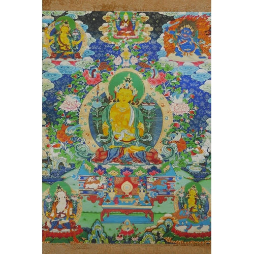 278 - A Tibetan printed Thangka depicting Manjushri, with a silk surround, 39 x 49cm