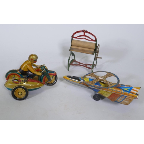 279 - A vintage Japanese tin-plate 'Spectro Rocket', 25cm long, and a tin plate model of a motorcycle and ... 