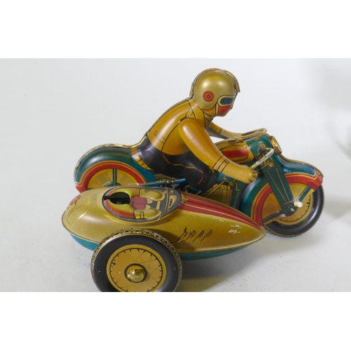 279 - A vintage Japanese tin-plate 'Spectro Rocket', 25cm long, and a tin plate model of a motorcycle and ... 