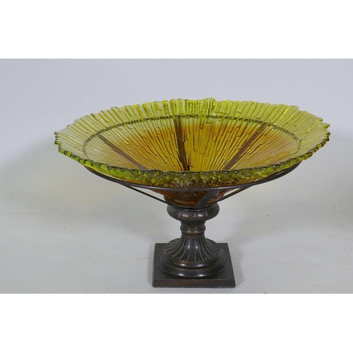 28 - A studio amber glass bowl, raised n a bronzed metal stand, 38cm diameter, 24cm high