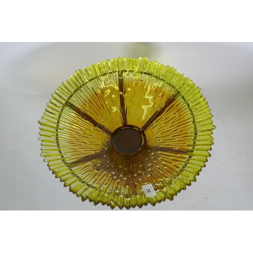 28 - A studio amber glass bowl, raised n a bronzed metal stand, 38cm diameter, 24cm high