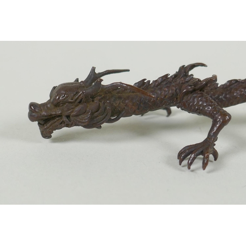 285 - A Japanese style bronze okimono dragon, 16cm high