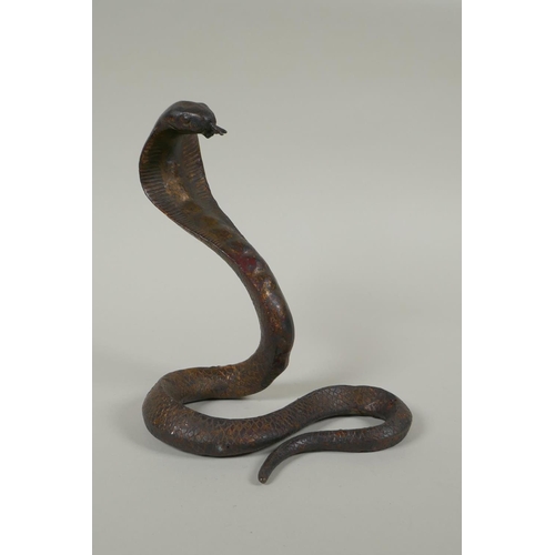 287 - A Tibetan gilt bronze figure of a cobra, 18cm high