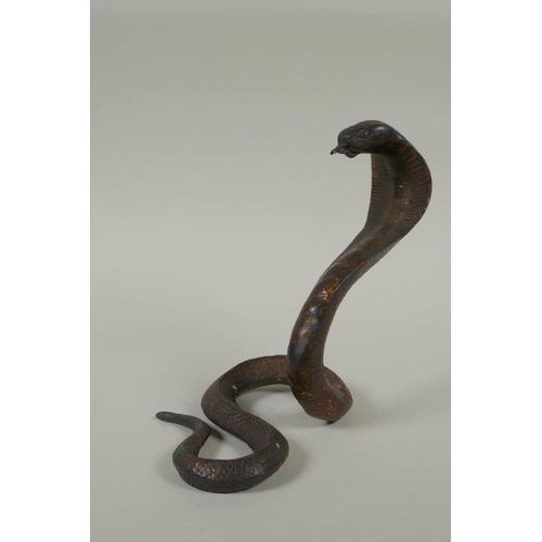 287 - A Tibetan gilt bronze figure of a cobra, 18cm high