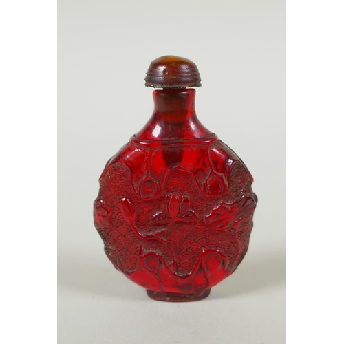 288 - A Chinese amber style snuff bottle with lotus pond decoration, 7cm high