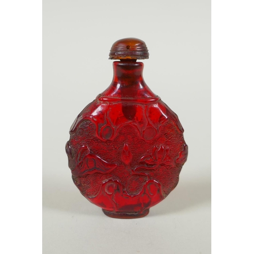 288 - A Chinese amber style snuff bottle with lotus pond decoration, 7cm high