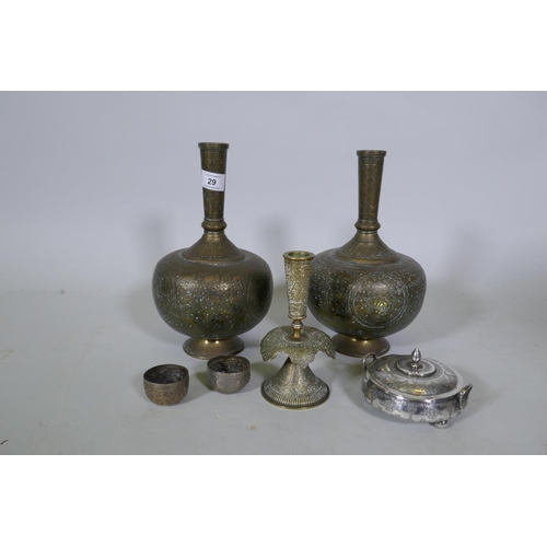 29 - A pair of Indian brass vases with repousse decoration, 29cm high, a candlestick, a white metal dish ... 