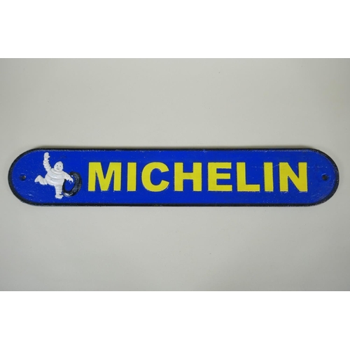 294 - A 'Michelin' painted cast iron wall plaque, 50cm long