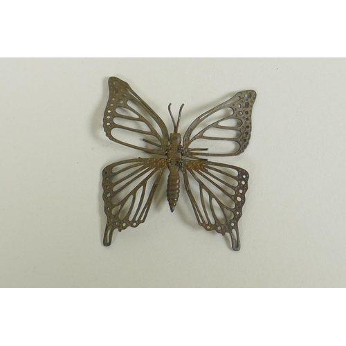 296 - A Japanese style bronze okimono butterfly with articulated wings, 7cm 