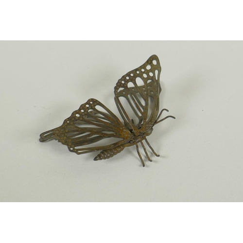 296 - A Japanese style bronze okimono butterfly with articulated wings, 7cm 