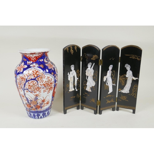 297 - A C19th Japanese Imari porcelain ribbed vase with decorative floral panels, 24cm high, and a Japanes... 